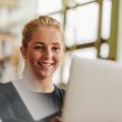 Girl studying with laptop in university class