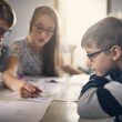 Elementary school kids doing homework at home